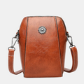 Chris Compact Mini Handbag shown in full-grain leather
